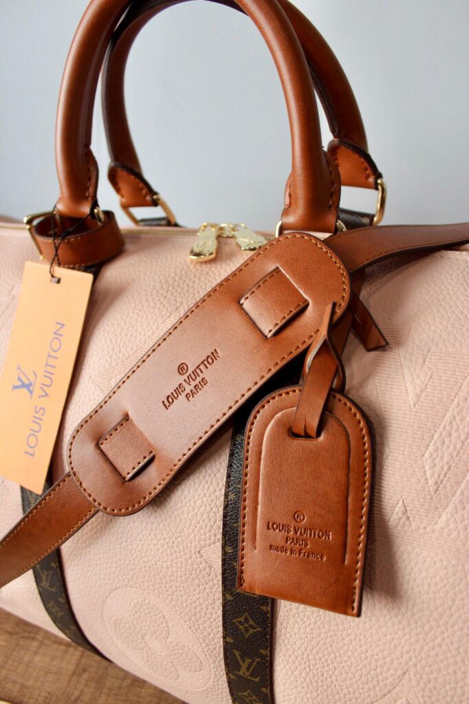 louis vuitton canta keepall bandouliere pembe logo monogram el valizi 50x29x23